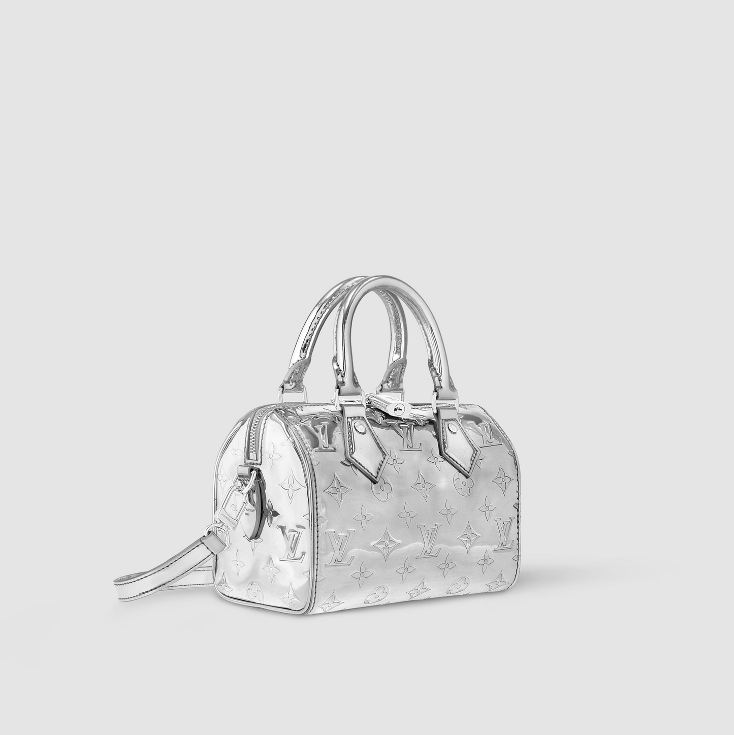 Silver handbag with reflective pattern on a light gray background
