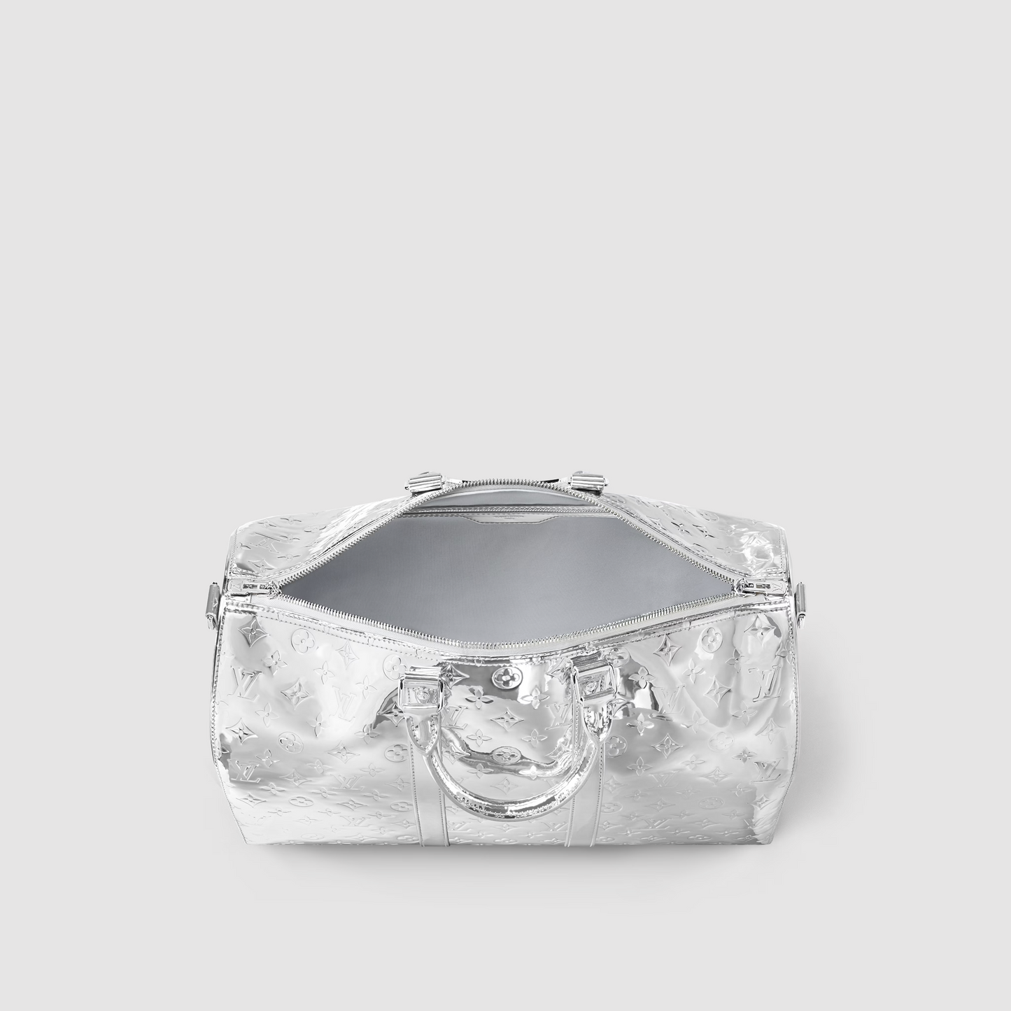 Clear handbag with a reflective surface on a light gray background