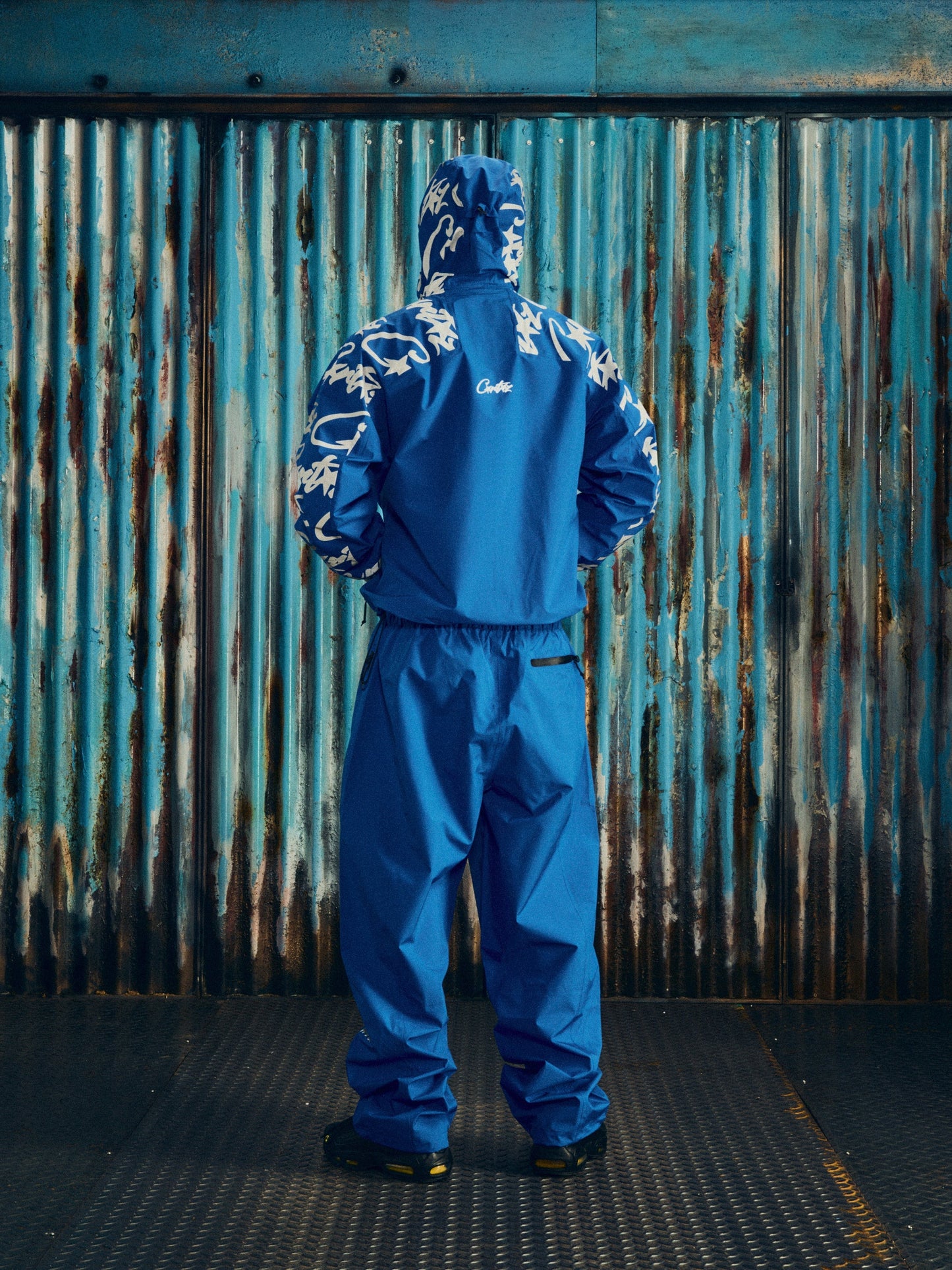 Corteiz Blue Nylon Elitework Waterproof Shell Jacket, close-up of Elitework and Alcatraz chest embroidery