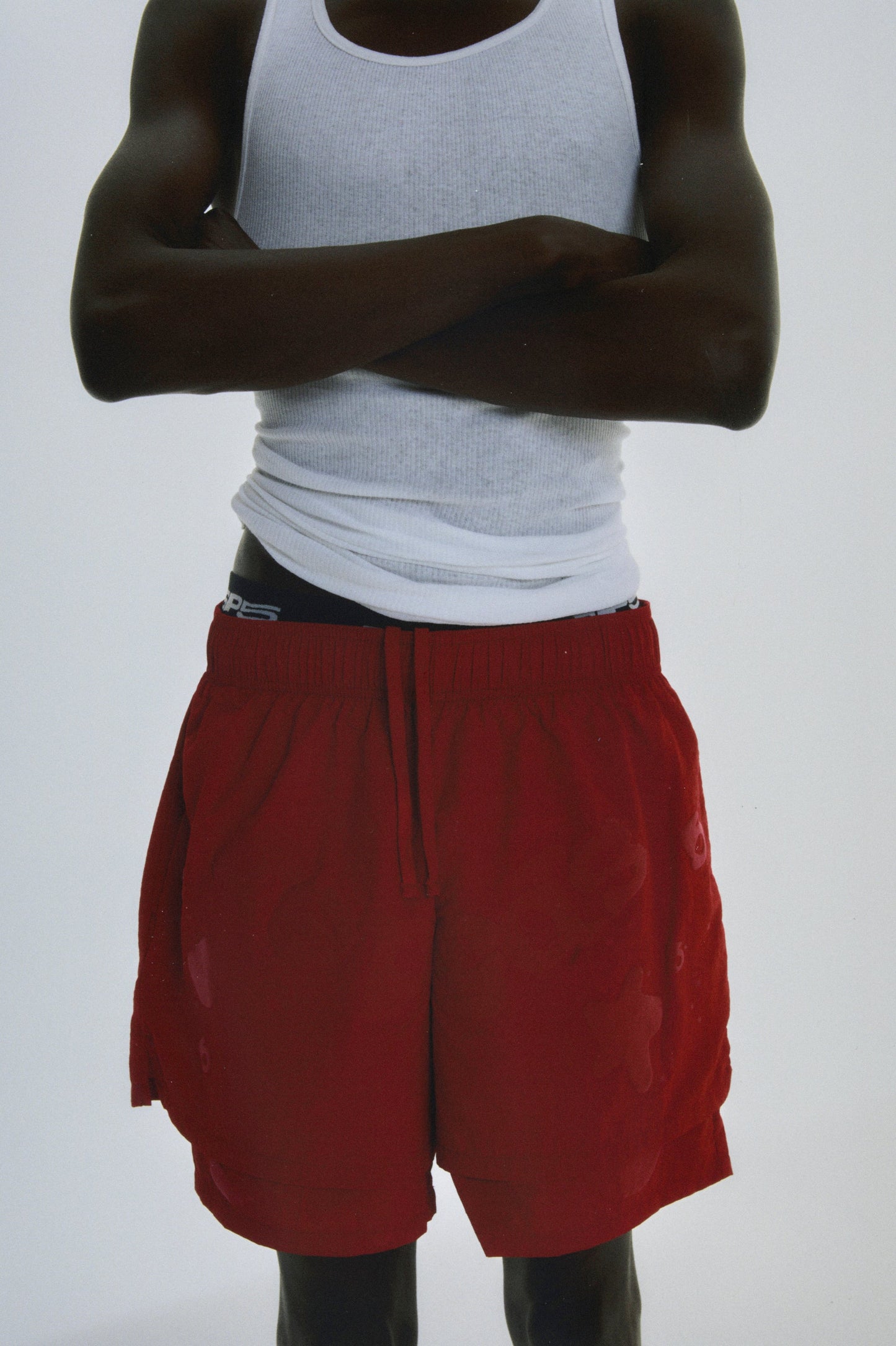 Folded flat view of SP5DER Beluga Double Layer Short in Red