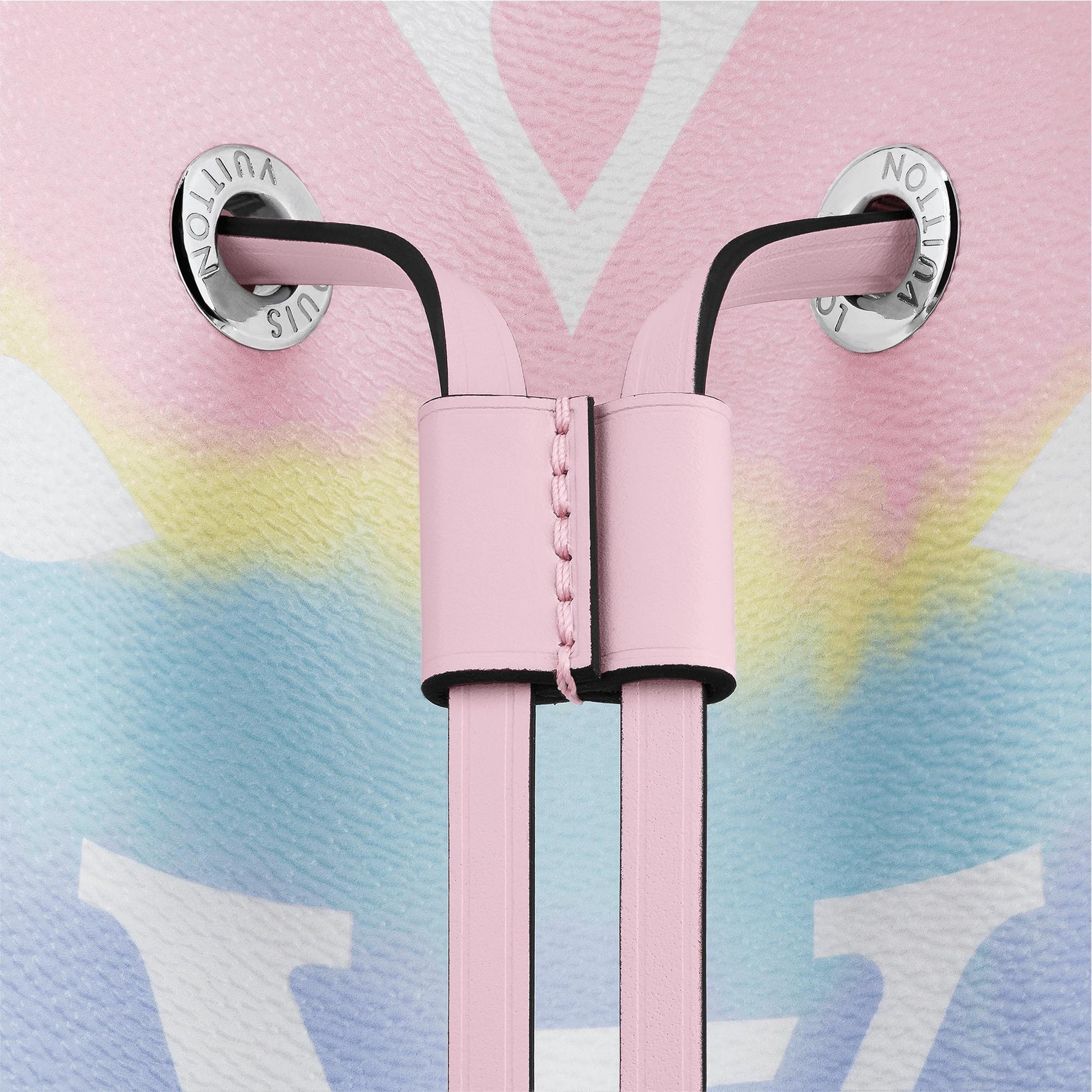 Pink earbuds with a branded case on a colorful background