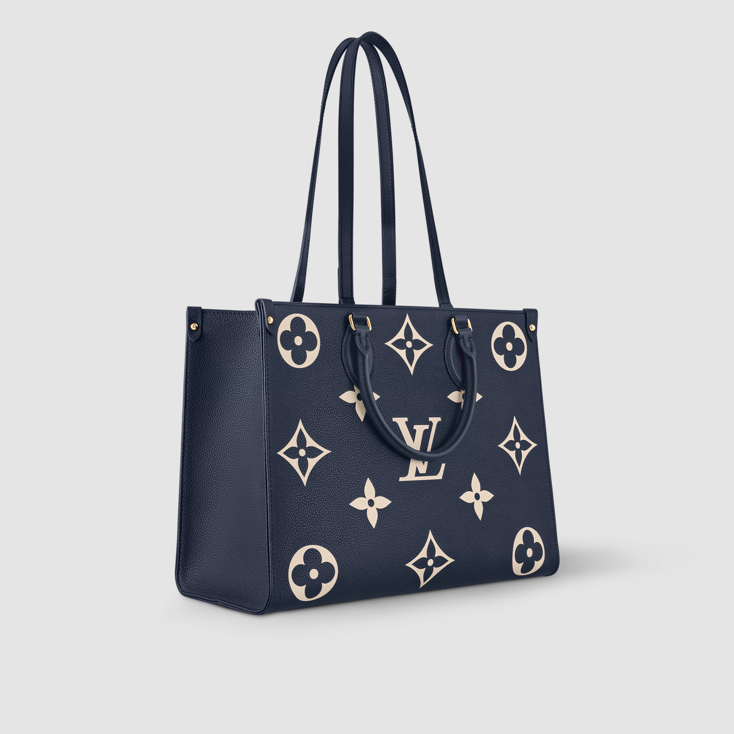 Navy blue handbag with beige monogram pattern on a light gray background