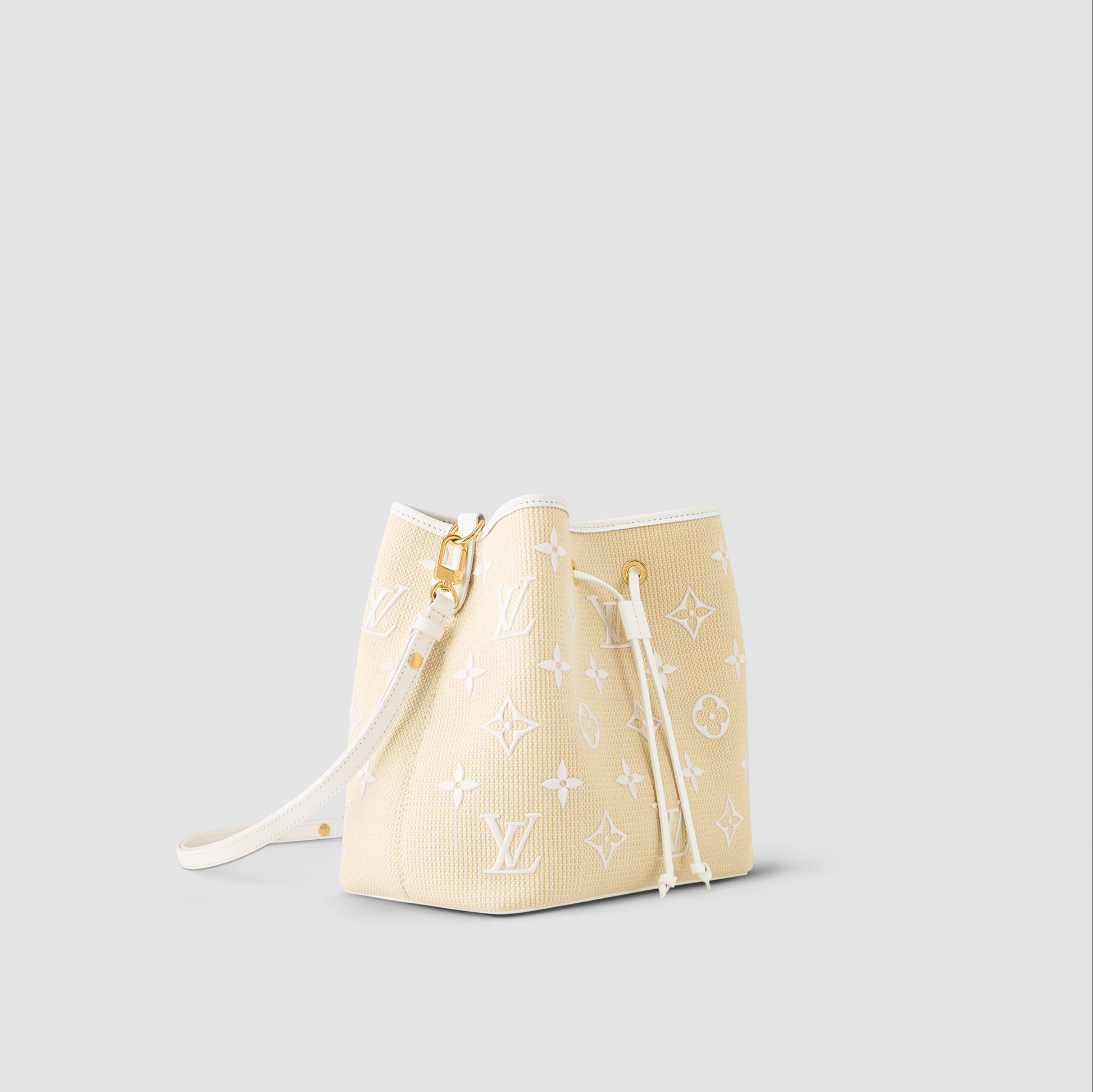 Cream-colored handbag with brand logo on a light gray background