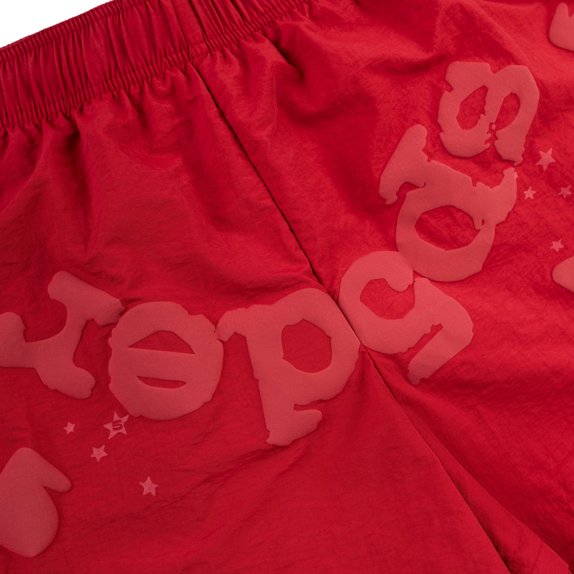 Side view of SP5DER Beluga Double Layer Short in Red