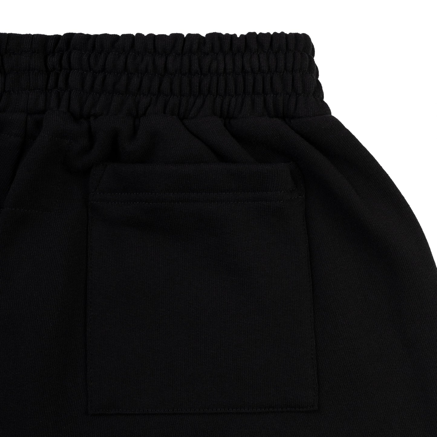 Folded flat view of SP5DER Beluga Outline Sweatshort in Black