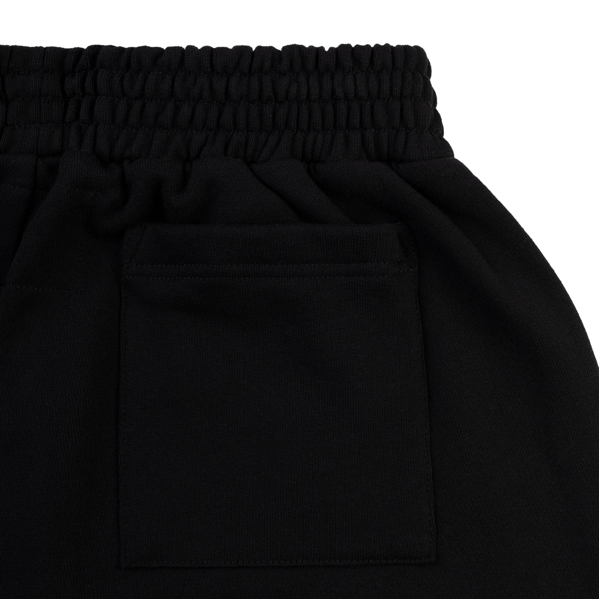 Folded flat view of SP5DER Beluga Outline Sweatshort in Black