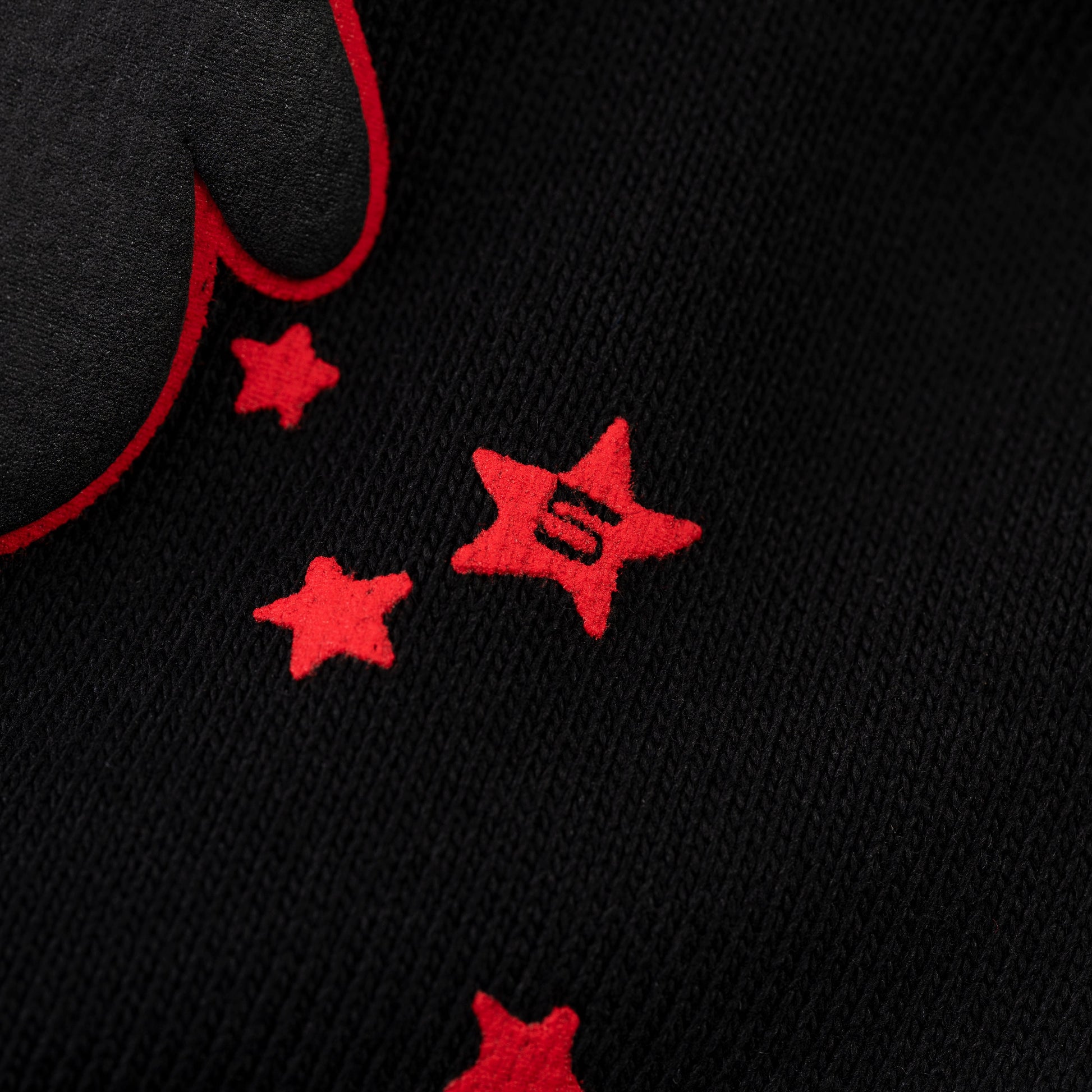 Close-up view of SP5DER Beluga Outline Sweatshort in Black