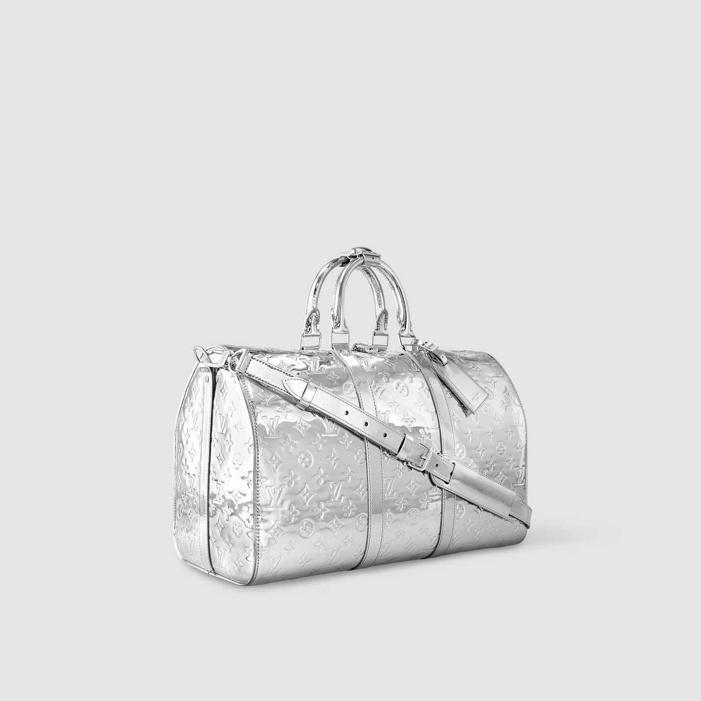 Silver metallic duffel bag on a light gray background