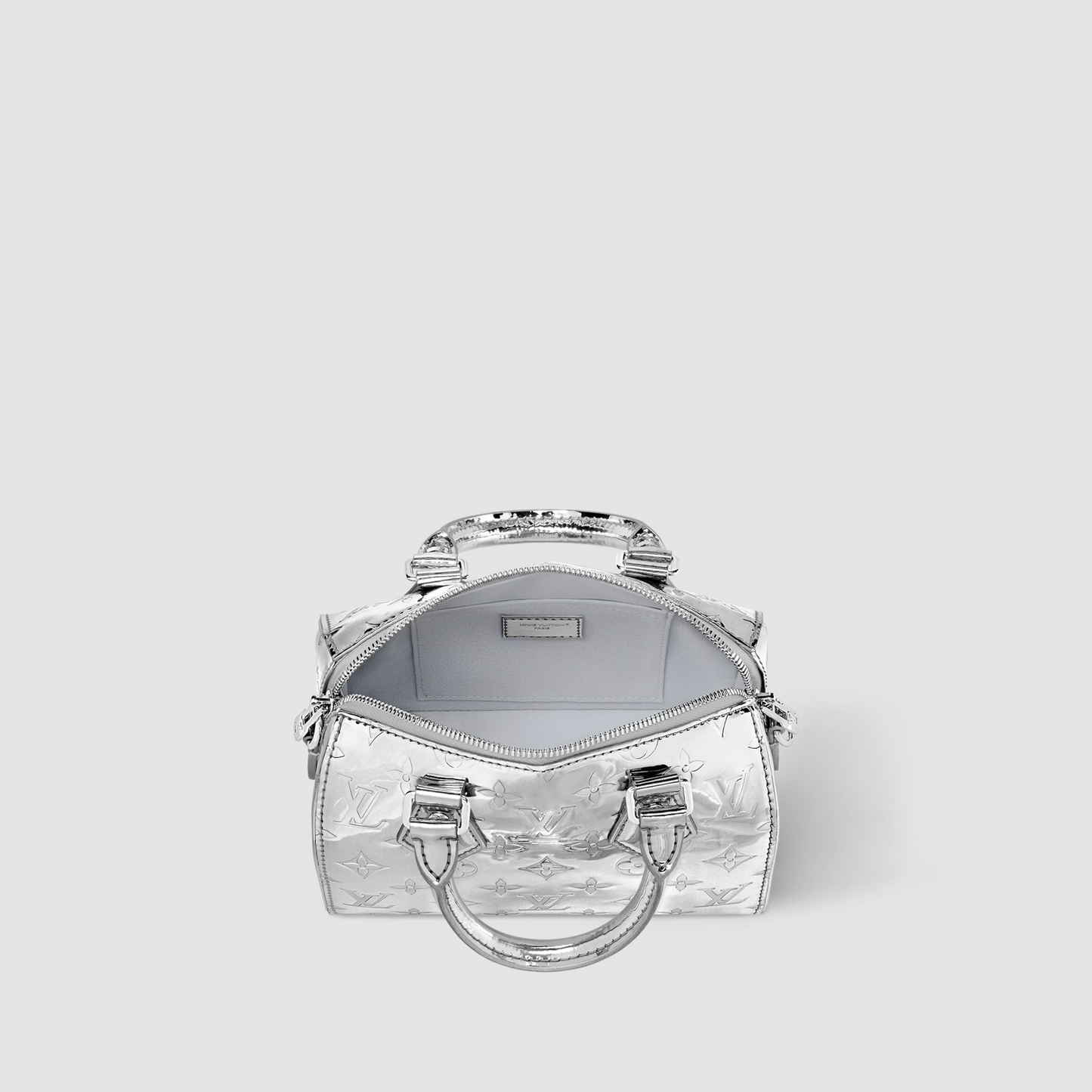 Silver handbag with a reflective surface on a white background