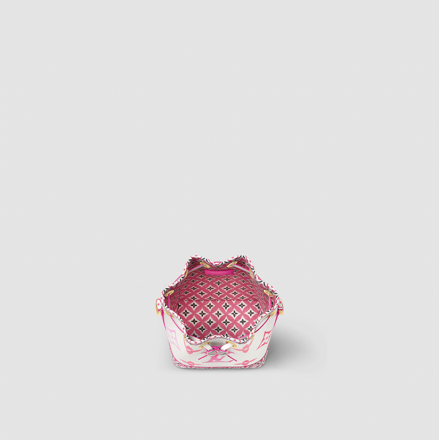 Small decorative basket with pink interior on a light gray background