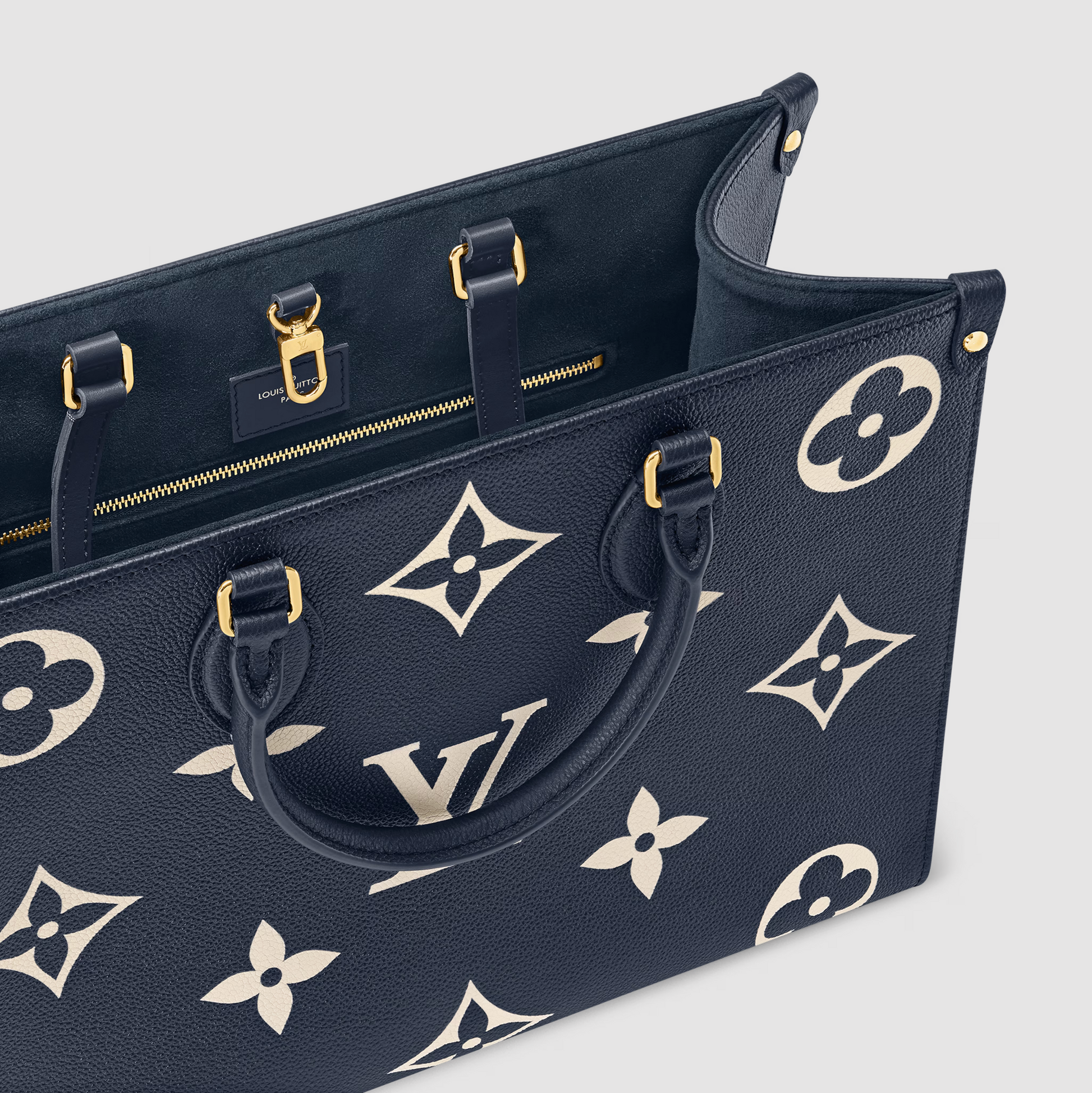 Black handbag with white floral pattern on a light gray background