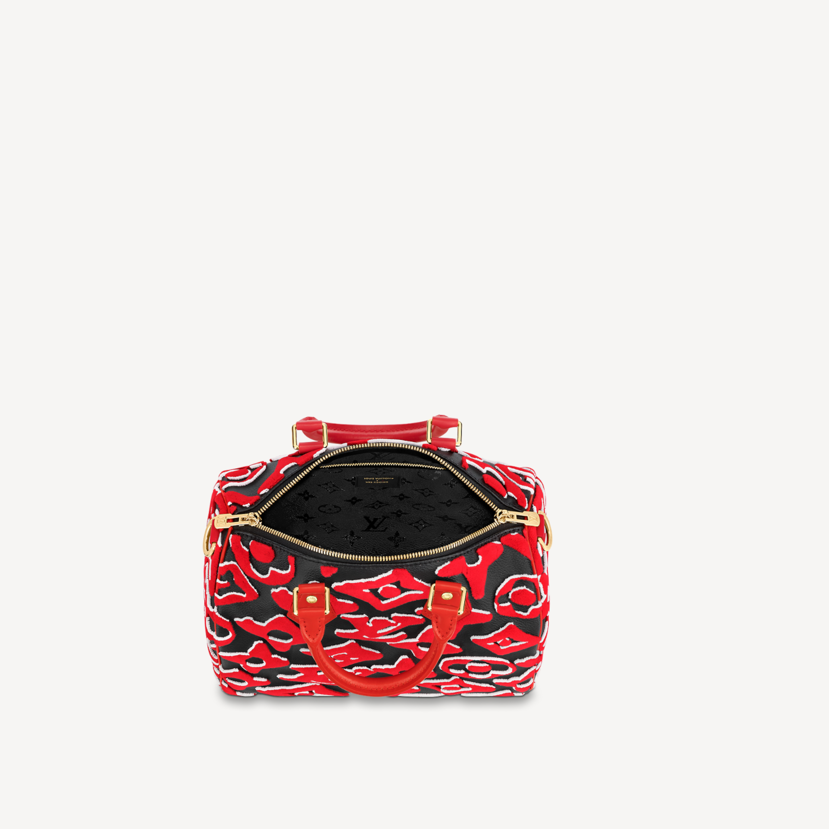 Red and black patterned handbag with gold accents on a white background