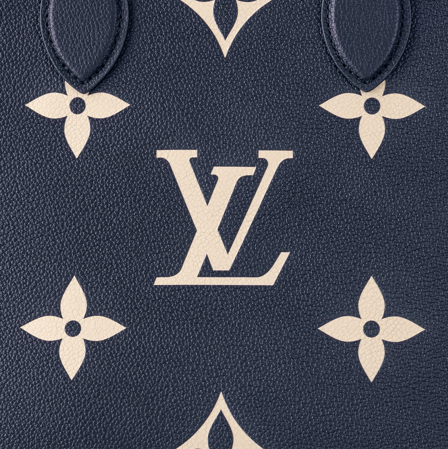 Close-up of a patterned surface with a prominent logo on a dark blue background