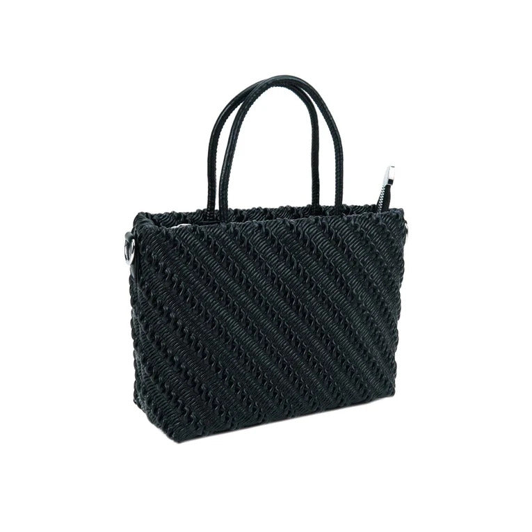 Black woven handbag on a white background