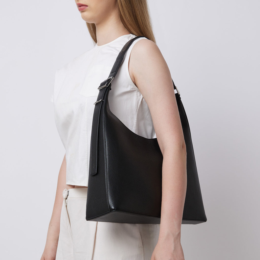 Bag It Danny Flatiron black leather shoulder bag worn on the shoulder