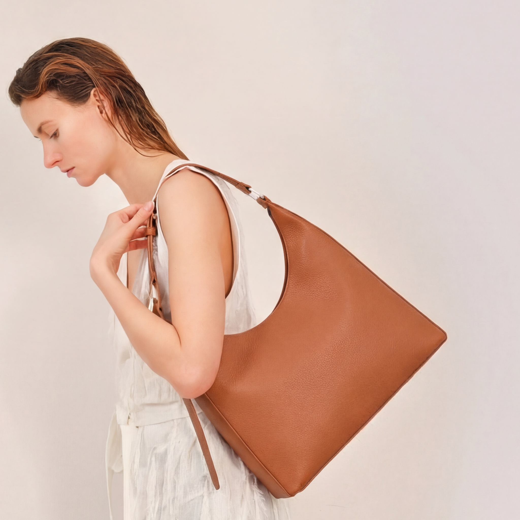 Bag It Danny Flatiron clay pebble leather shoulder bag, studio front view