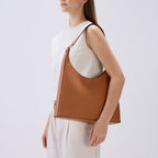 Bag It Danny Flatiron clay leather shoulder bag worn on the shoulder