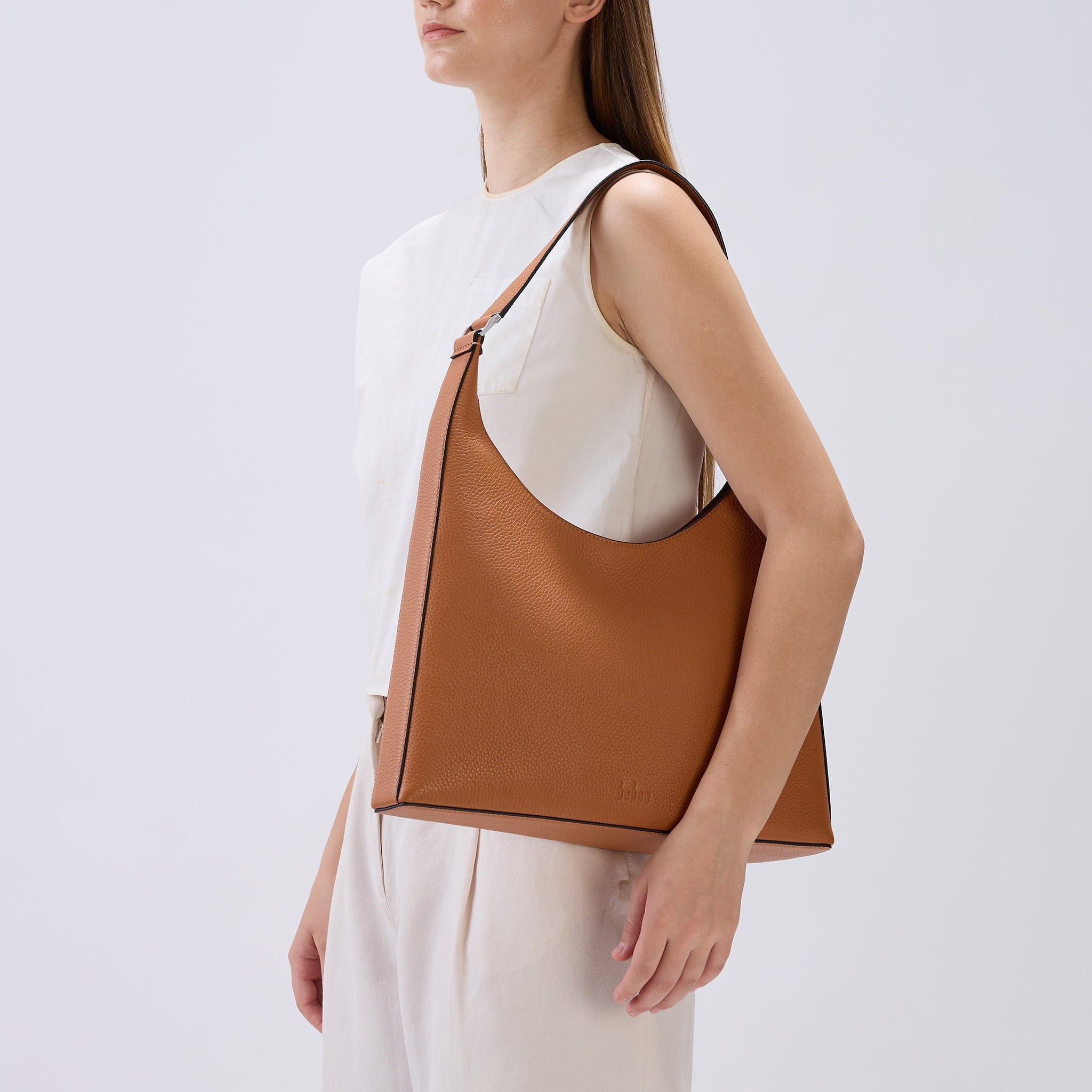 Bag It Danny Flatiron clay leather shoulder bag worn on the shoulder