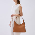 Bag It Danny Flatiron clay leather shoulder bag worn on the arm
