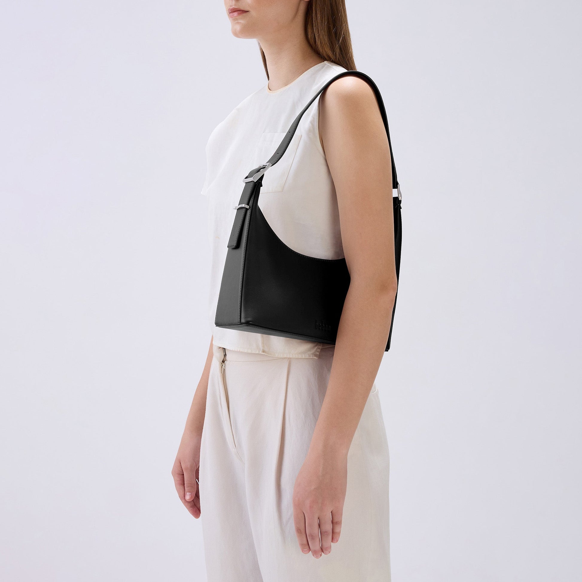 Bag It Danny Flatiron black leather shoulder bag worn on the shoulder