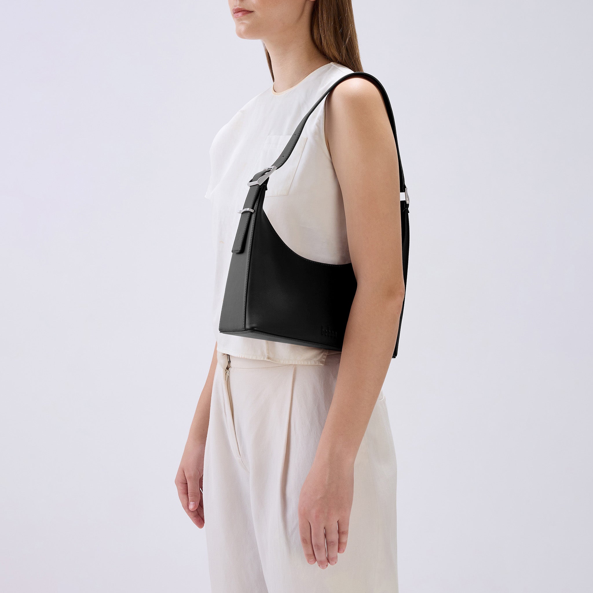 Bag It Danny Flatiron black leather shoulder bag worn on the shoulder