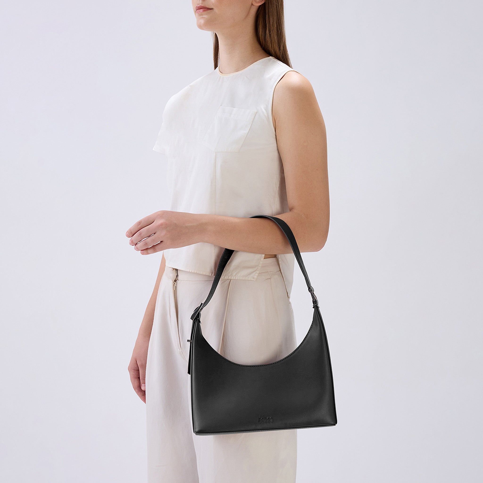 Bag It Danny Flatiron black Nappa leather shoulder bag worn on the arm