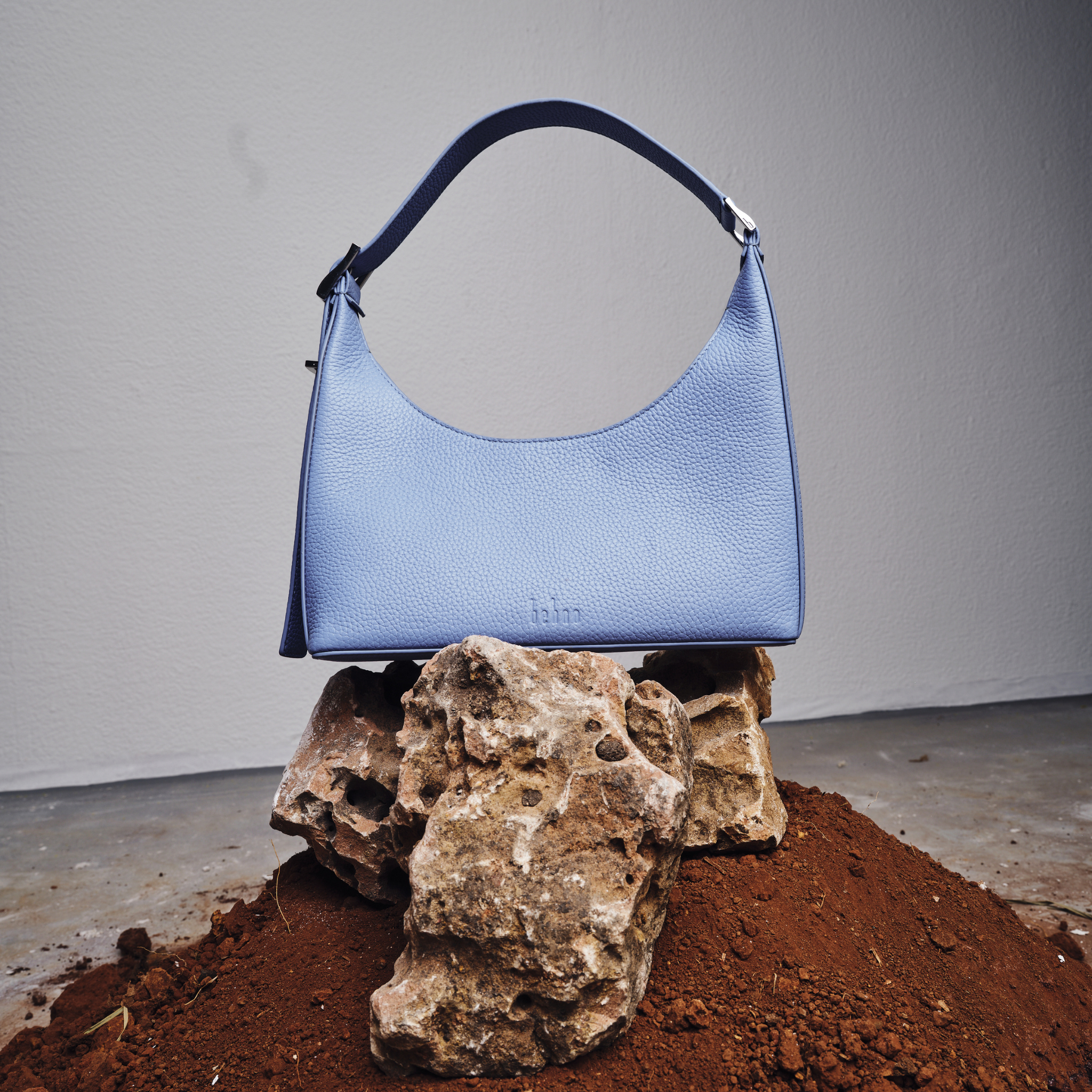 Bag It Danny Flatiron ocean blue pebble leather shoulder bag, studio front view