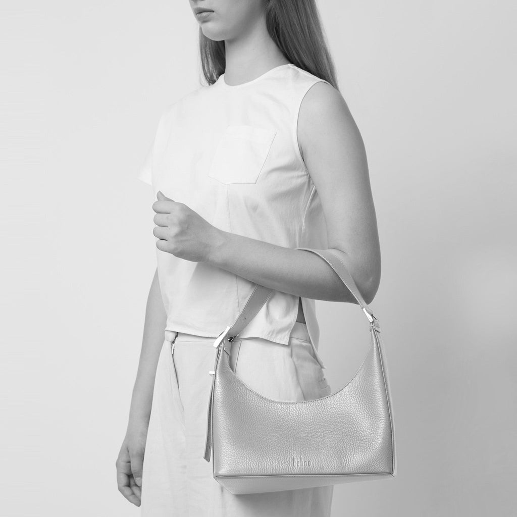 Bag It Danny Flatiron ocean blue leather shoulder bag worn on the arm