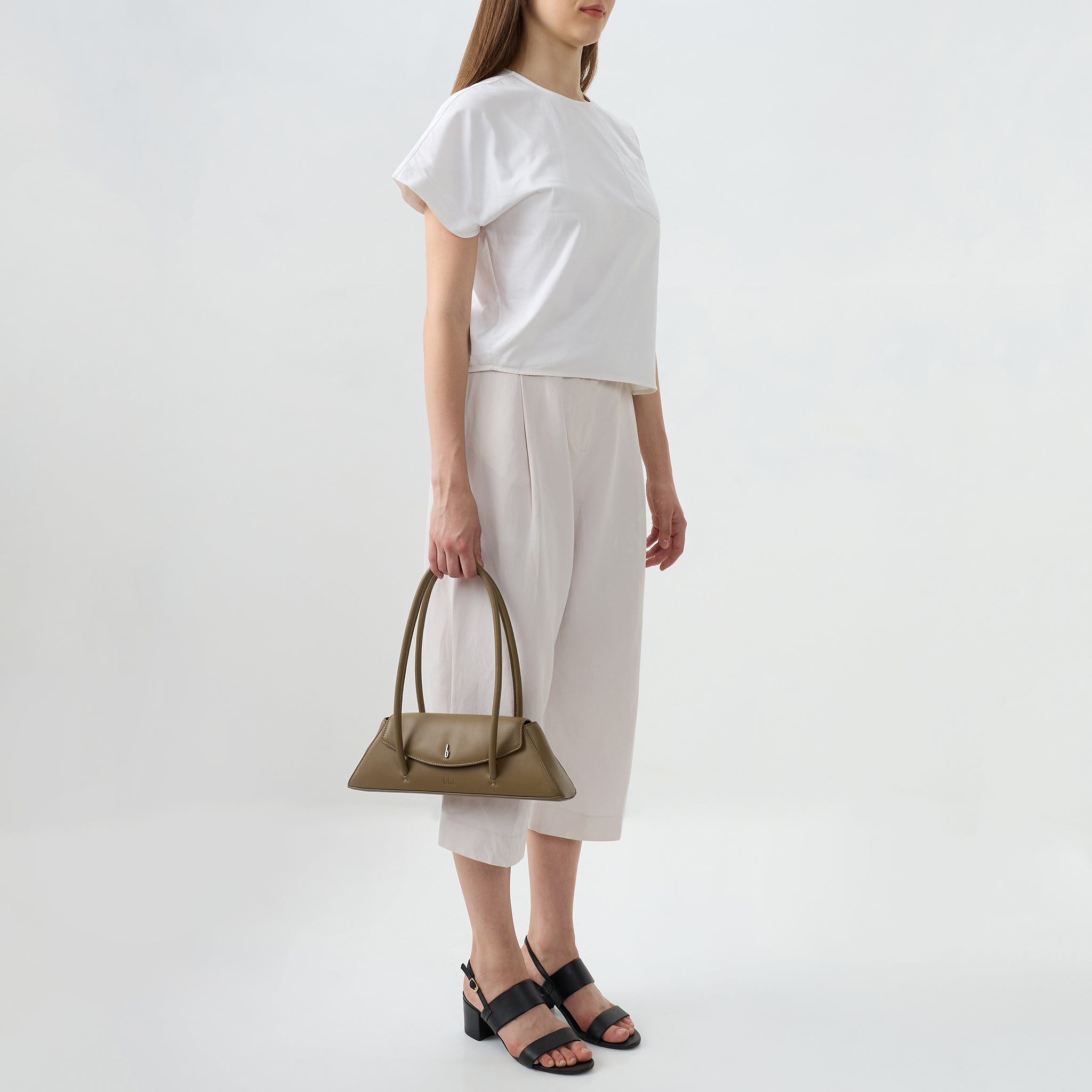 Bag It Diana palm green leather shoulder bag carried by hand