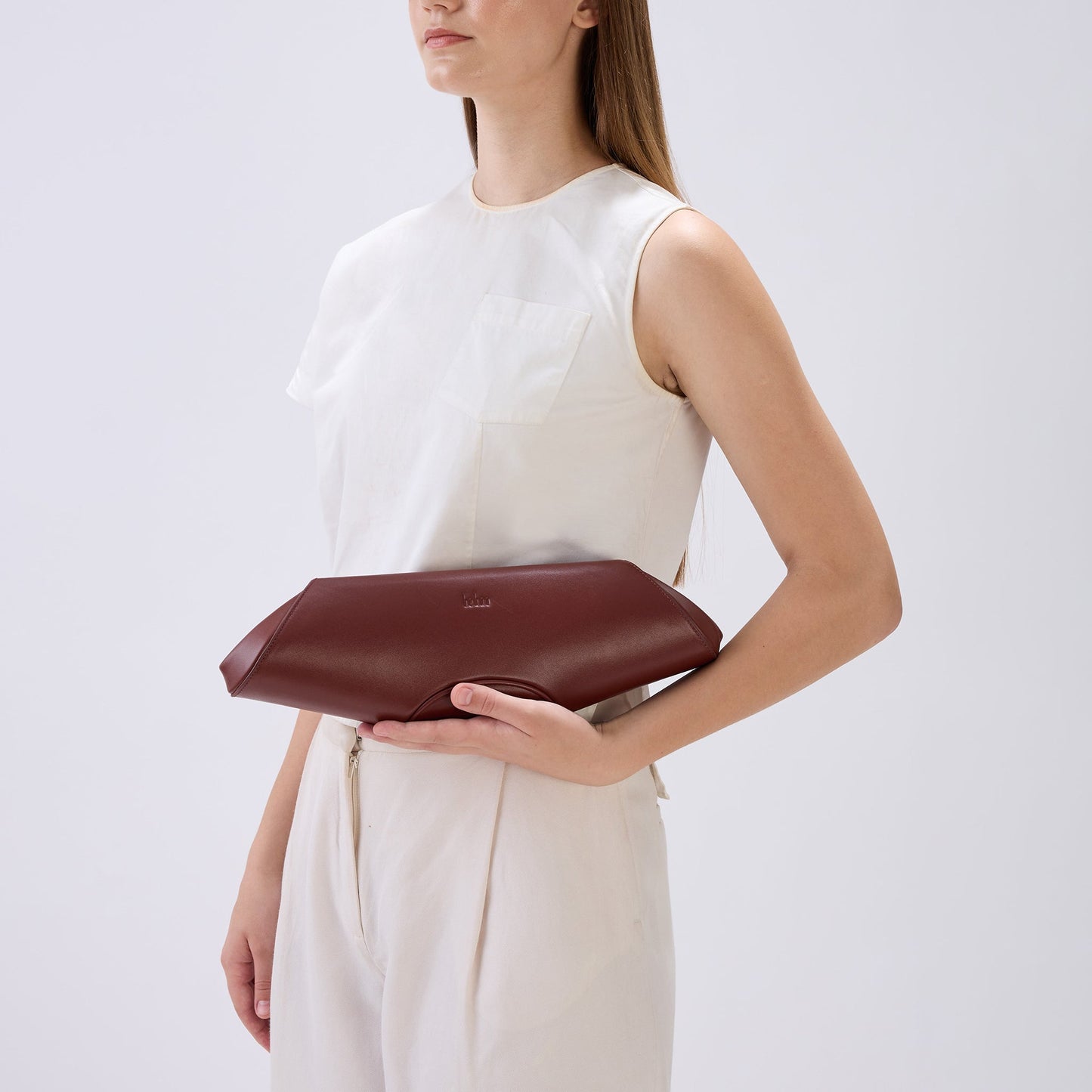 Bag It Elizabeth brick red Nappa leather baguette clutch worn on the arm