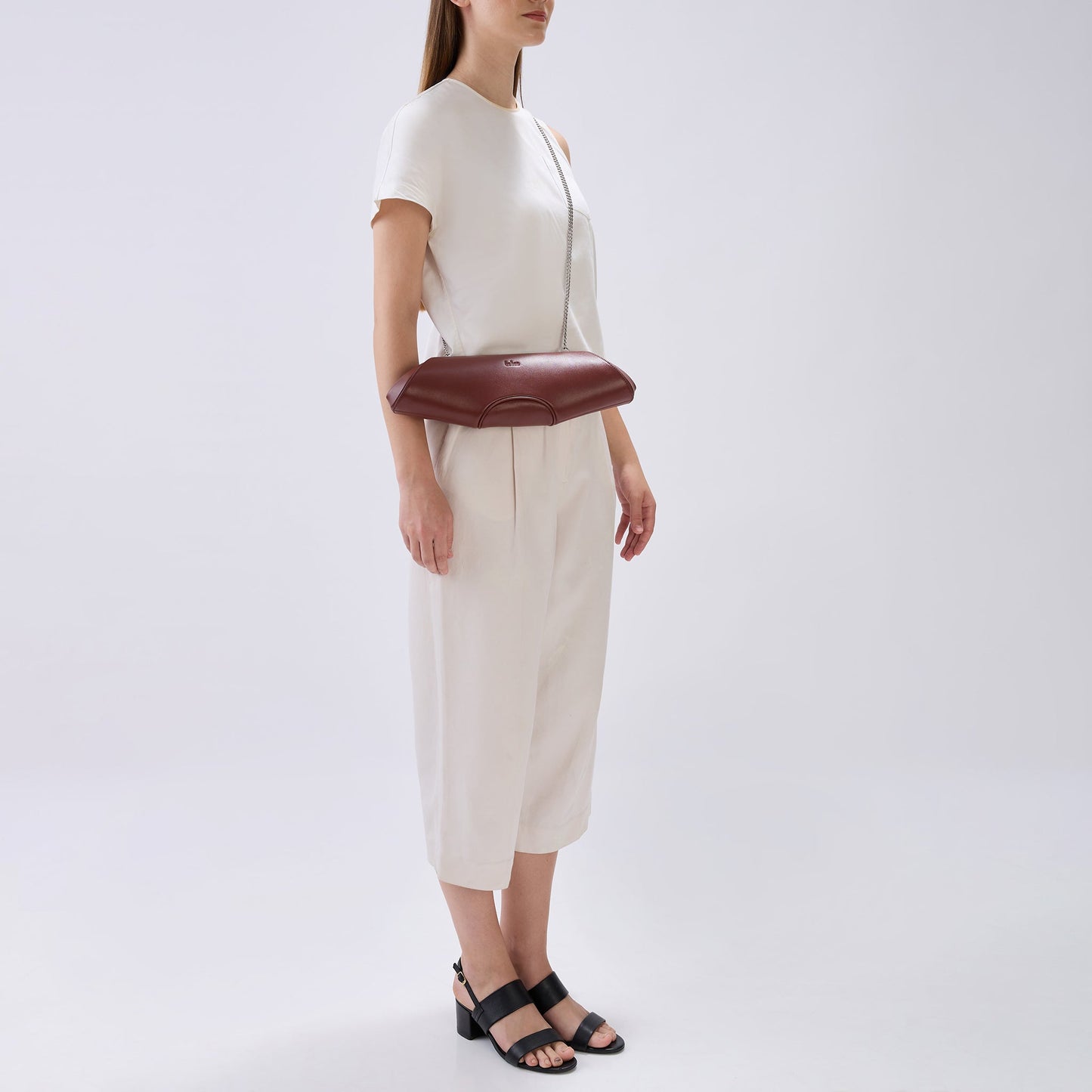 Bag It Elizabeth brick red baguette clutch worn on the shoulder