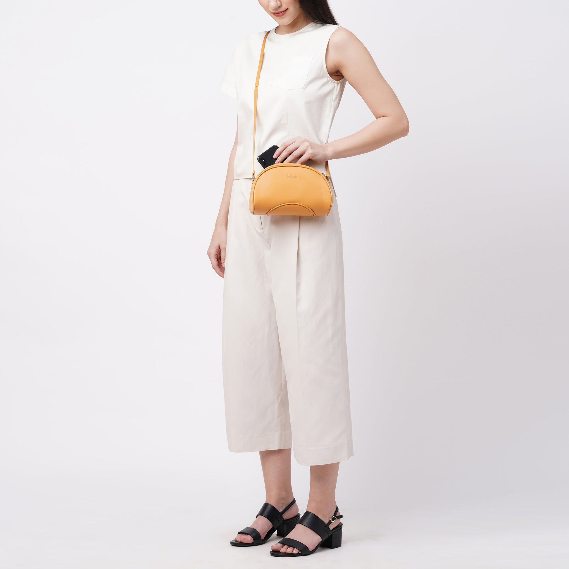 Bag It Elizabeth maize Nappa leather camera bag worn crossbody, alternate angle