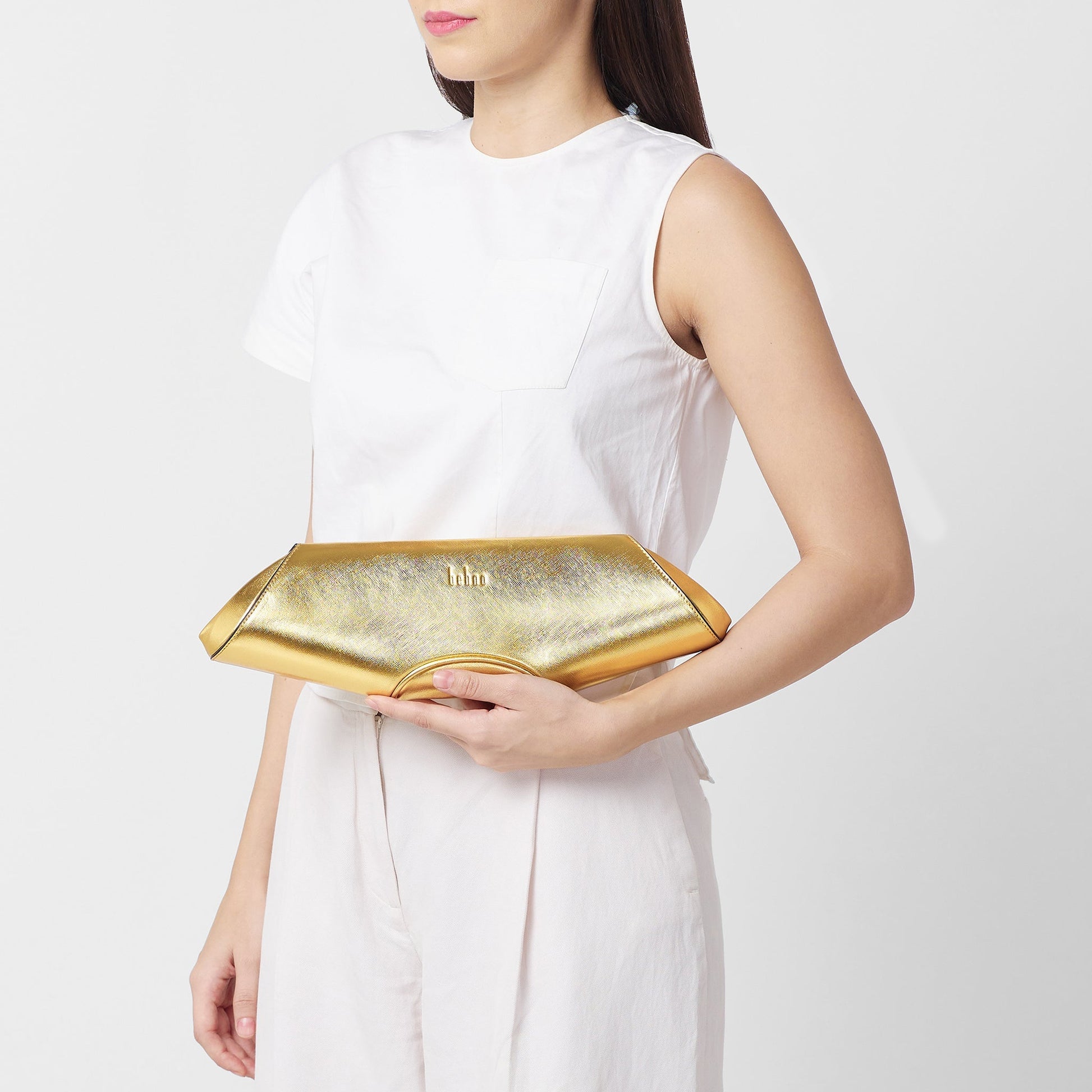 Bag It Elizabeth metallic gold baguette clutch worn on the shoulder