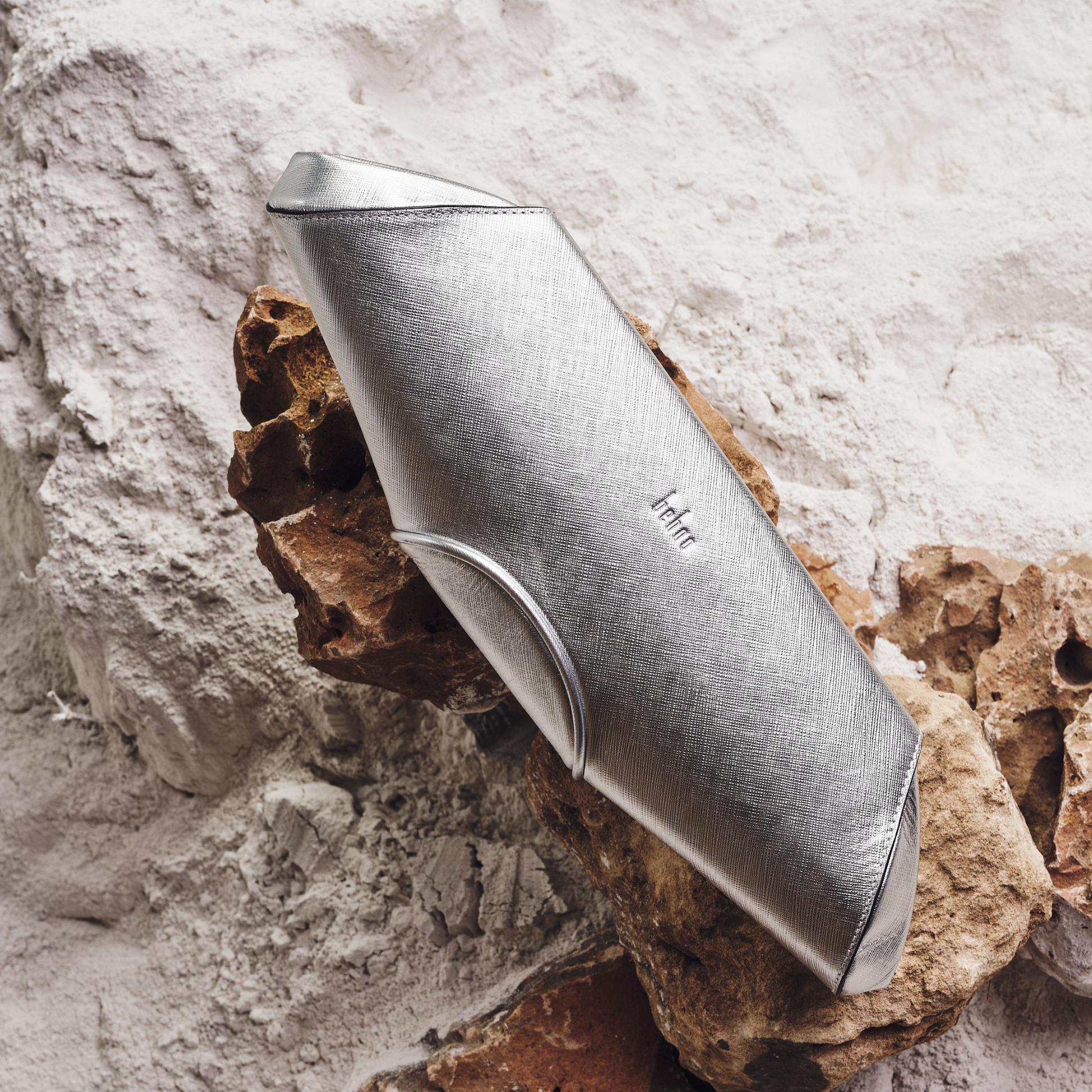 Bag It Elizabeth metallic silver baguette clutch, studio front view