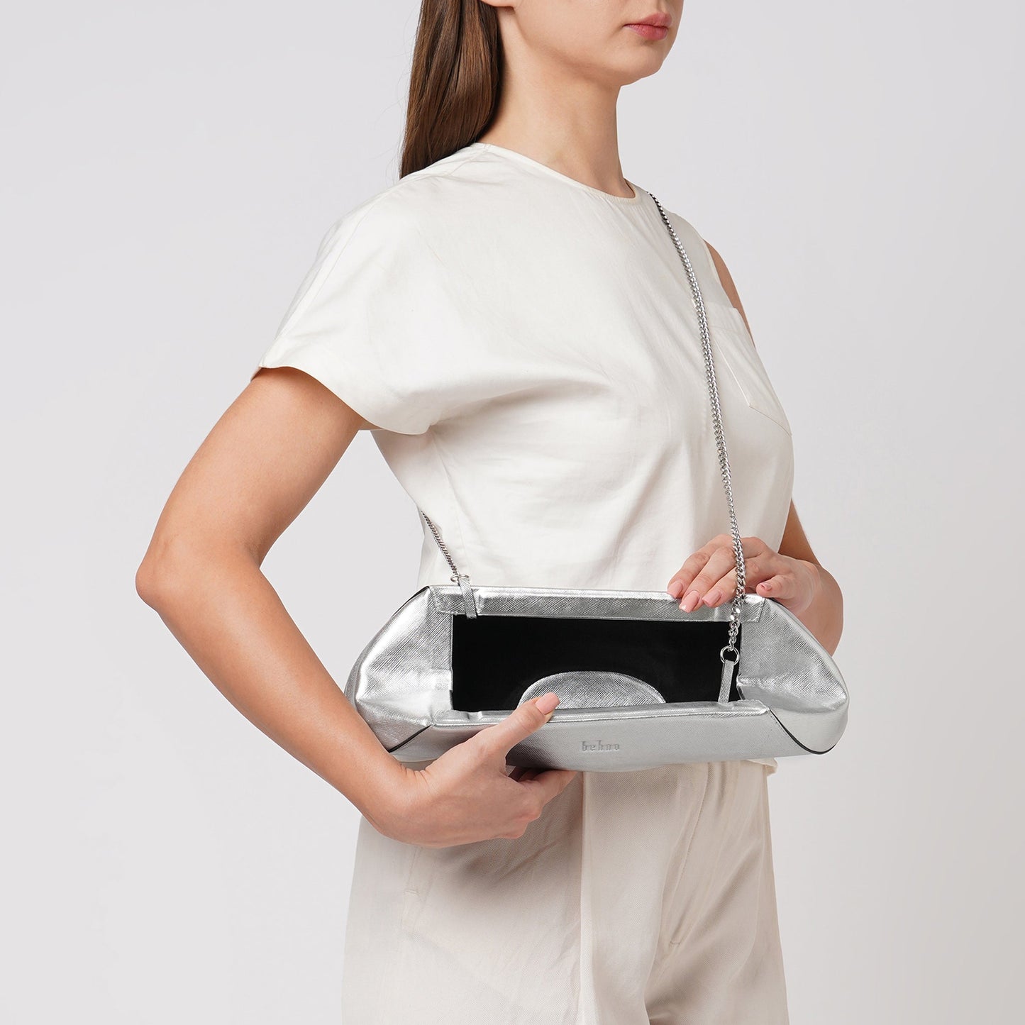 Bag It Elizabeth metallic silver baguette clutch worn crossbody, alternate angle