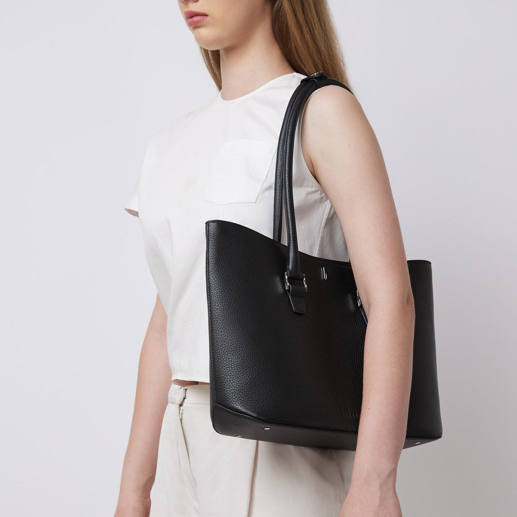 Bag It Elizabeth black pebble leather tote bag worn on the shoulder