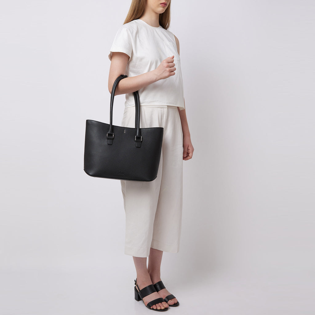 Bag It Elizabeth black pebble leather tote bag worn on the arm