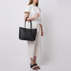 Bag It Elizabeth black pebble leather tote bag worn on the arm