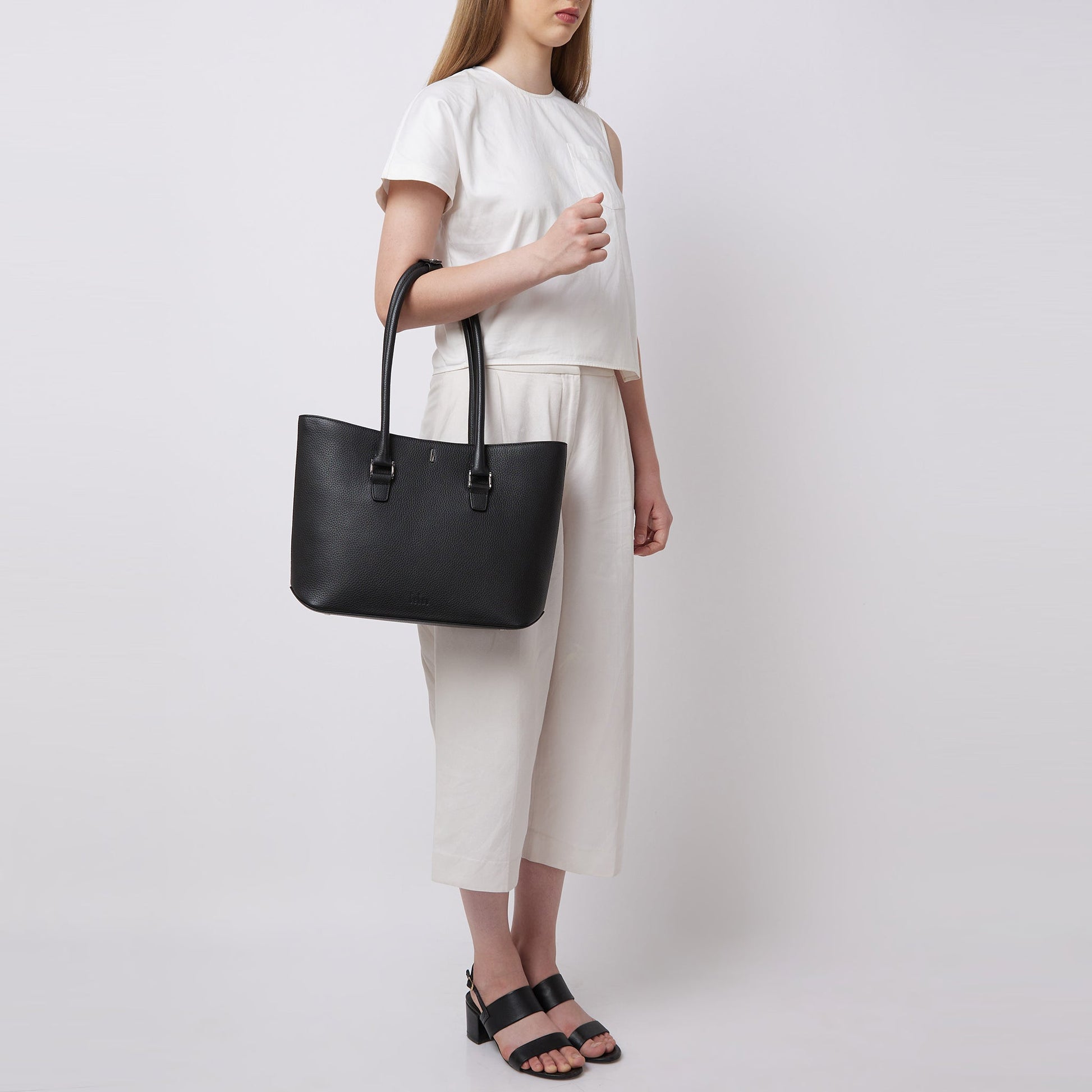 Bag It Elizabeth black pebble leather tote bag worn on the arm