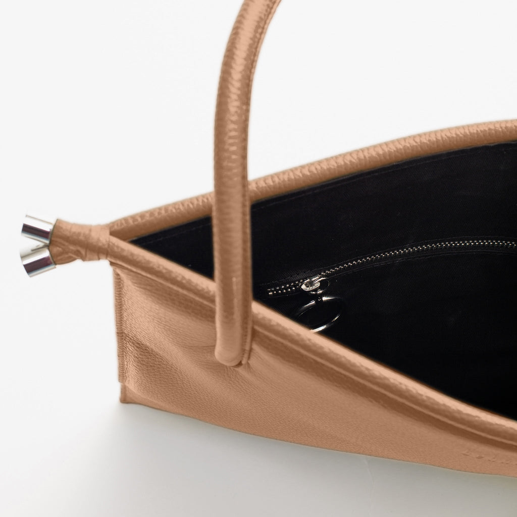 Close-up of the rope handle detail on the Bag It Frida almond pebble leather tote