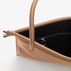 Close-up of the rope handle detail on the Bag It Frida almond pebble leather tote