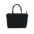 Black woven handbag on a white background