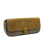 Two-tone handbag with gold clasp on a white background