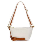 White handbag with brown accents on a white background