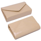 Two beige leather wallets on a white background