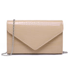 Beige crocodile-textured clutch bag with a chain strap on a white background