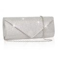 Silver clutch bag with chain strap on a white background