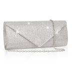 Silver clutch bag with chain strap on a white background