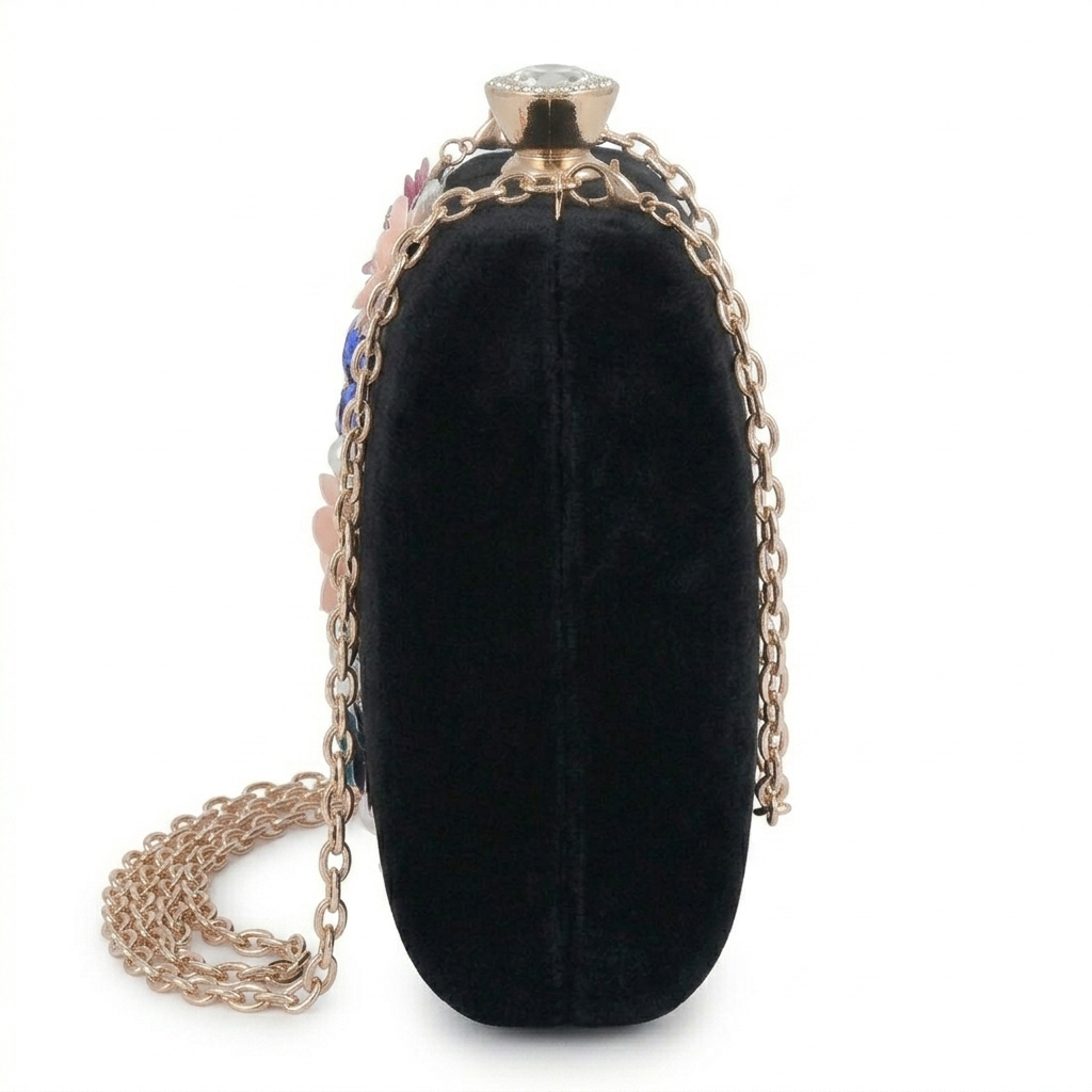 Black clutch bag with gold chain on a white background
