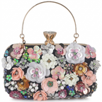 Decorative handbag with floral patterns and embellishments on a white background